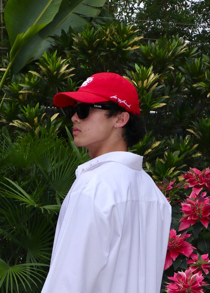 Signature red monogram cap, front view with embroidered logo