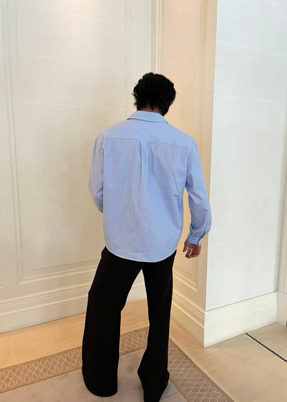 Blue stripe shirt showing slight crop at the hem