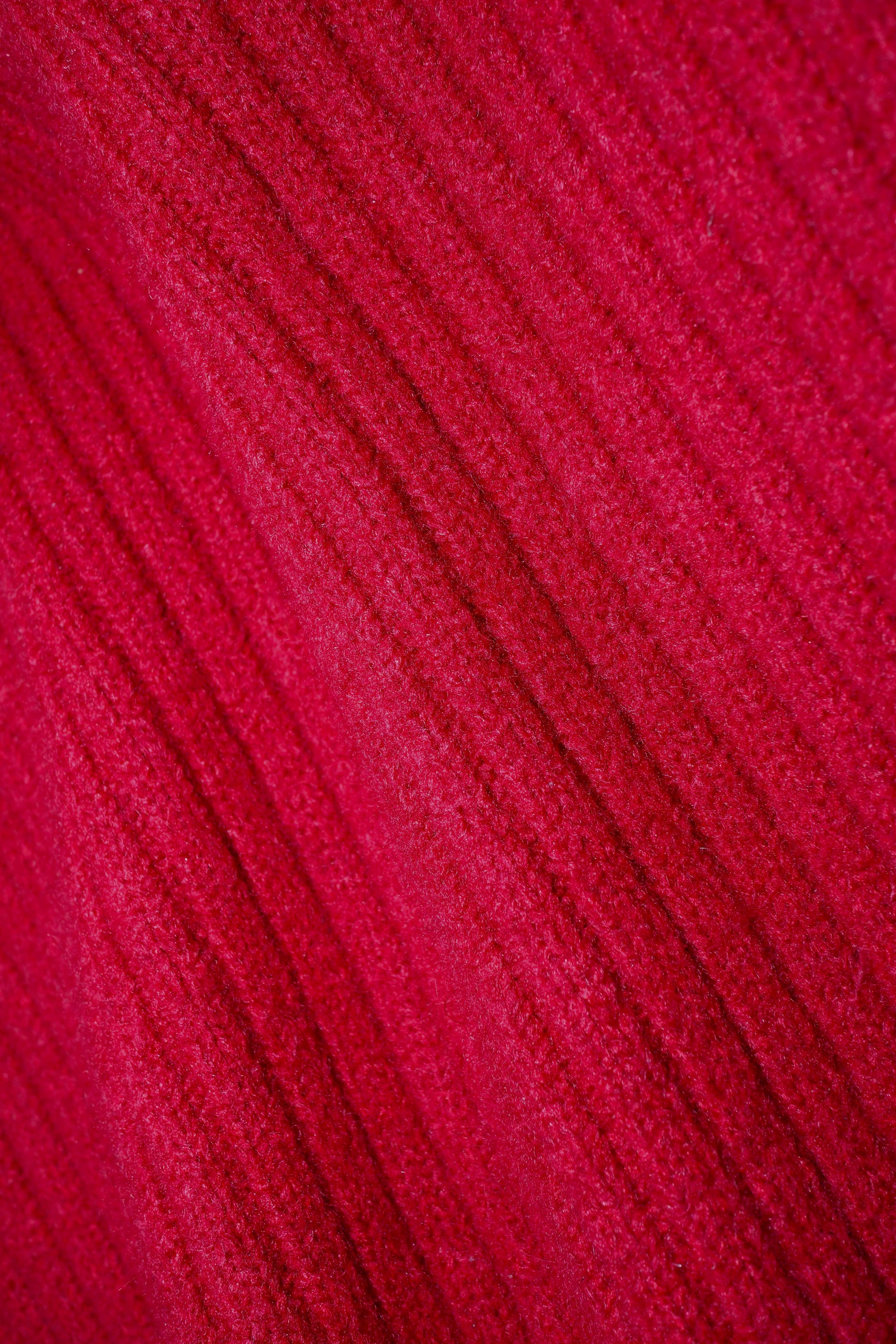 Close-up of a textured red fabric surface